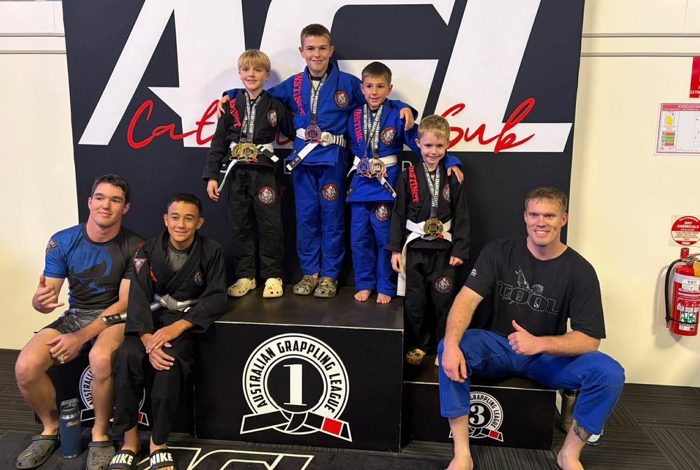 Instinct kids with their medals on the Australian Grappling League podium